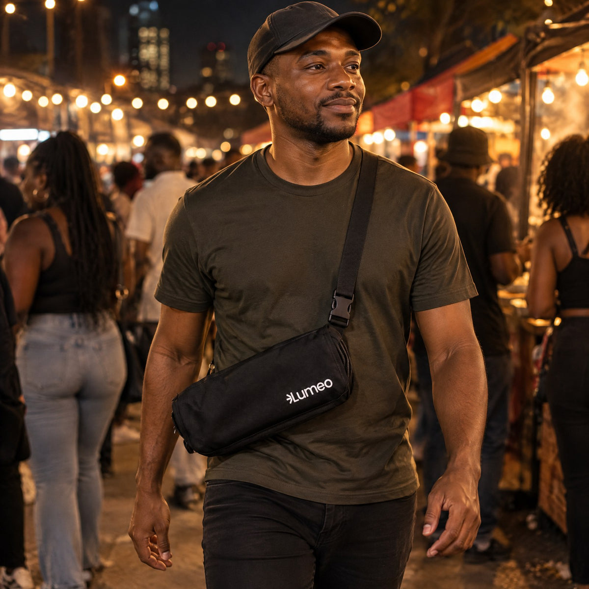 Lumeo Sling Stool worn crossbody at a night market